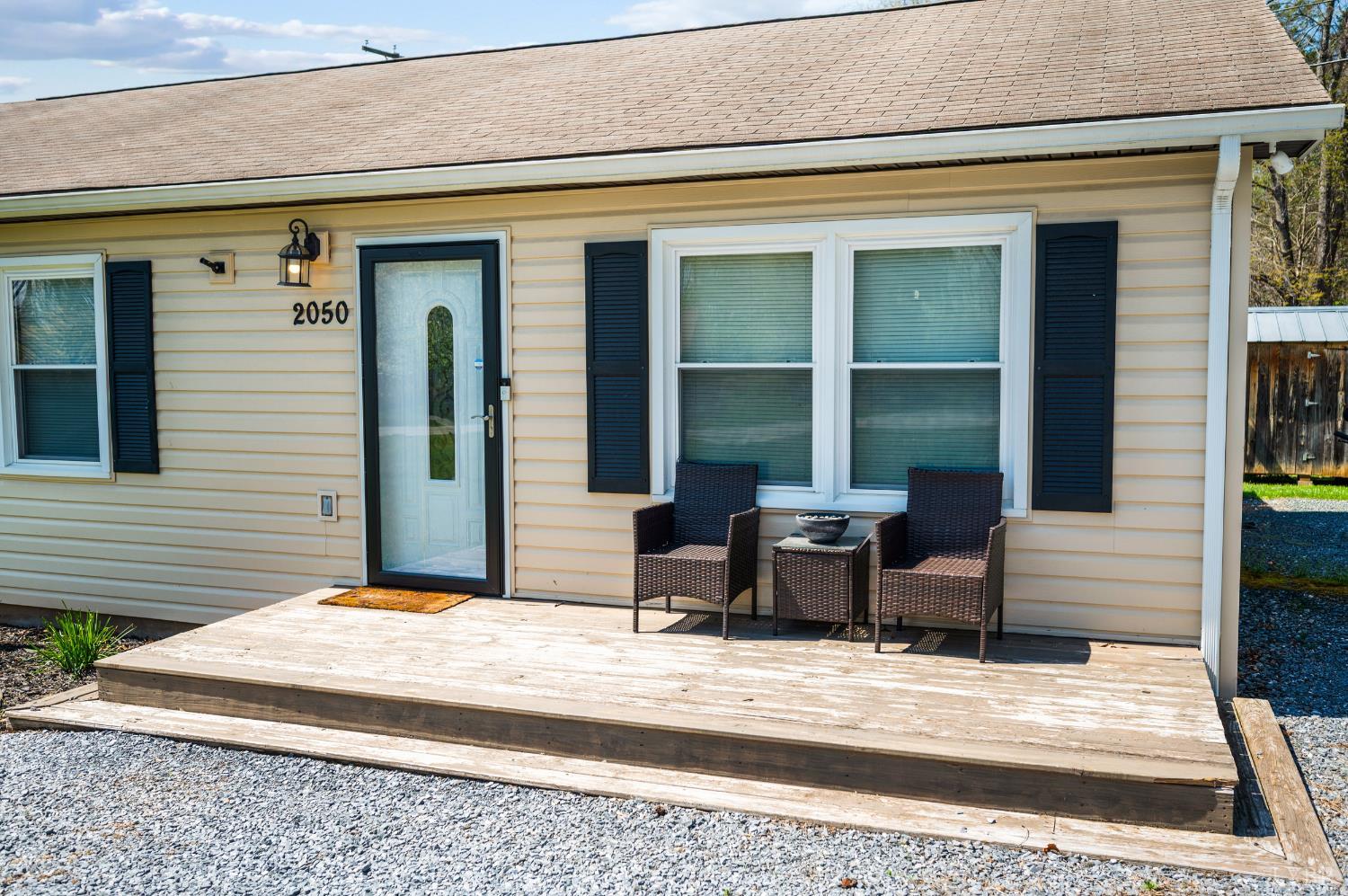 2050 Hawkins Mill Road Lynchburg, VA 24503 - Photo 4 of 32 a view of a house with a barbeque and bench