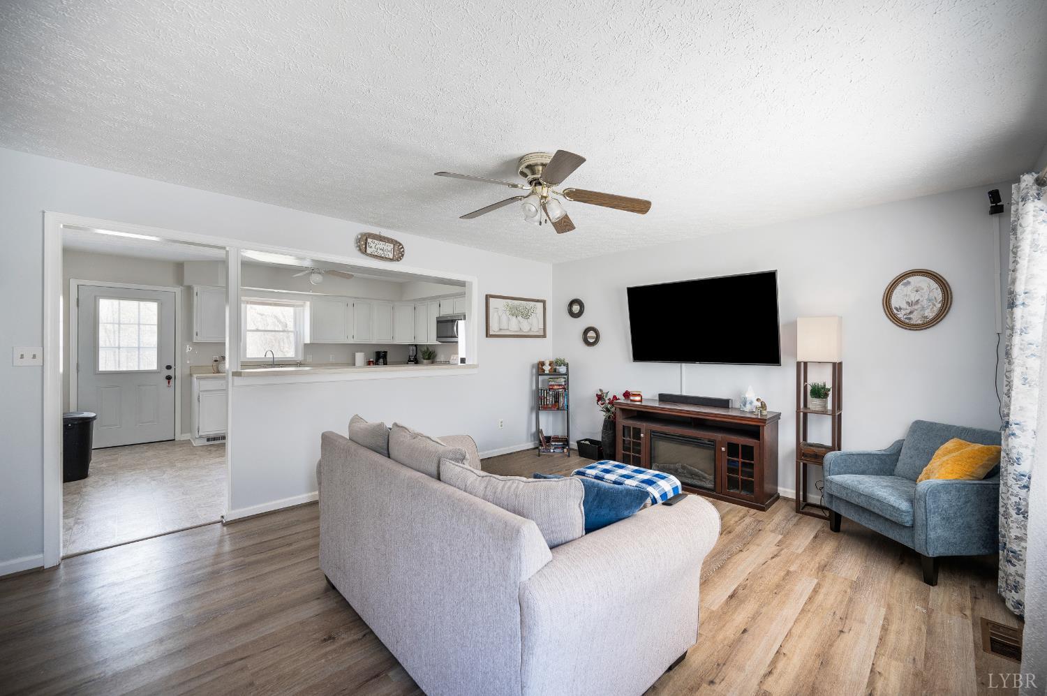 2050 Hawkins Mill Road Lynchburg, VA 24503 - Photo 6 of 32 a living room with furniture and a flat screen tv