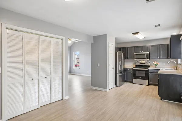 a view of kitchen with wooden floor