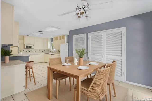 a view of a dining room with furniture and window