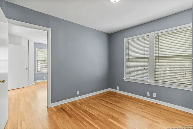 a view of a room that has a window in it