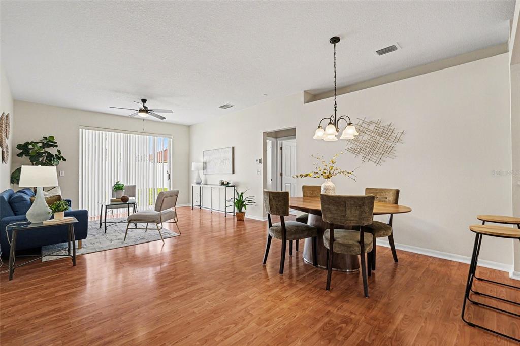 30631 Nickerson Loop Wesley Chapel, FL 33543 - Photo 11 of 33 a view of a dining room with furniture window and wooden floor
