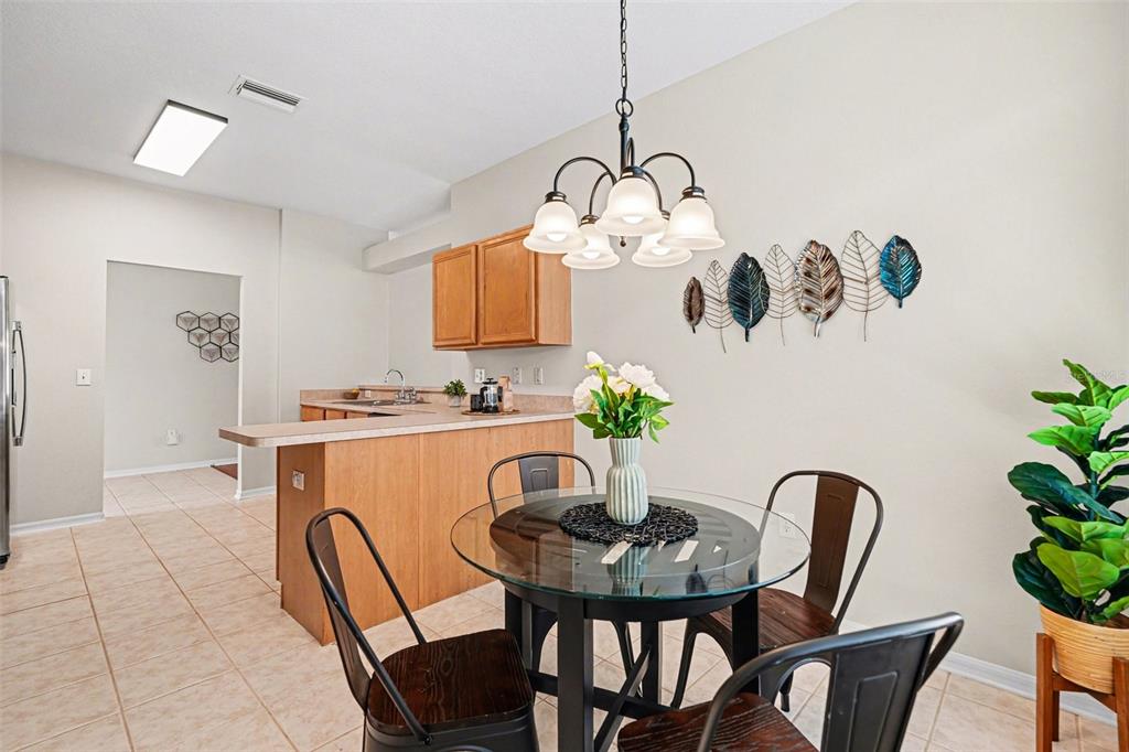 30631 Nickerson Loop Wesley Chapel, FL 33543 - Photo 16 of 33 a view of a dining room and a table or chairs