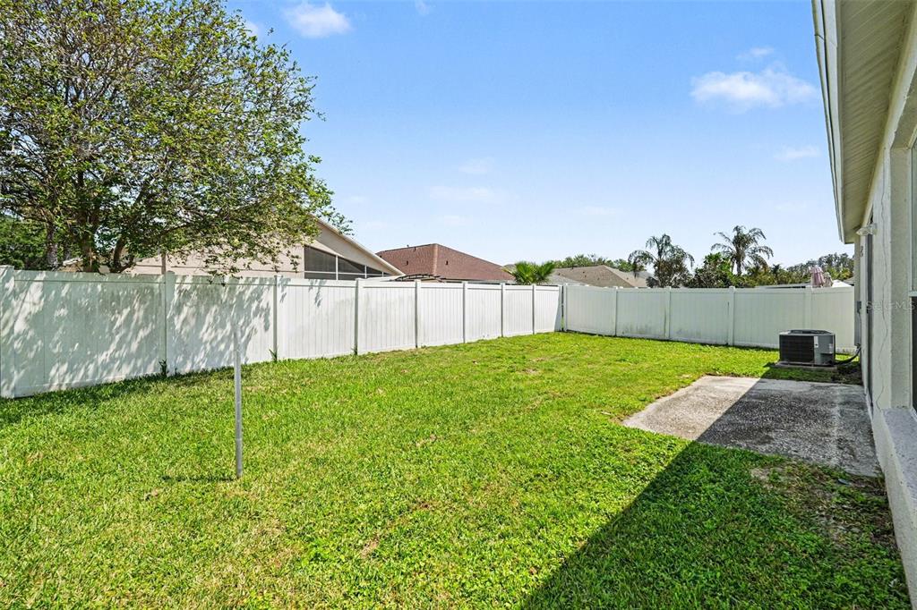 30631 Nickerson Loop Wesley Chapel, FL 33543 - Photo 29 of 33 a view of a backyard with barn