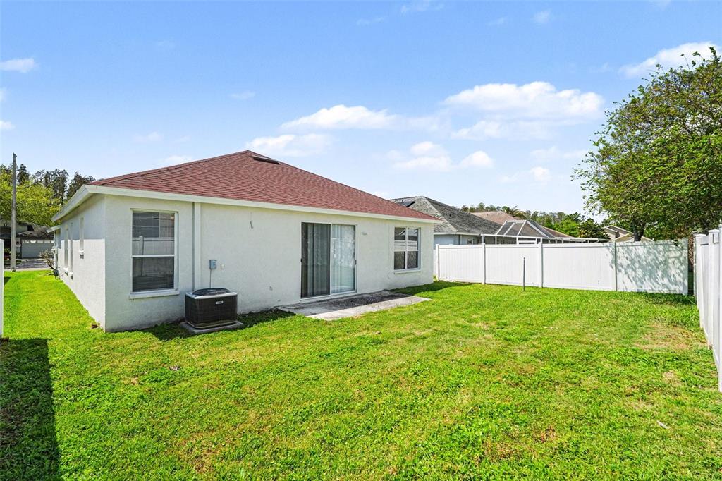 30631 Nickerson Loop Wesley Chapel, FL 33543 - Photo 30 of 33 a view of a house with a yard and sitting area