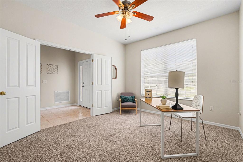 30631 Nickerson Loop Wesley Chapel, FL 33543 - Photo 8 of 33 a living room with furniture and a window