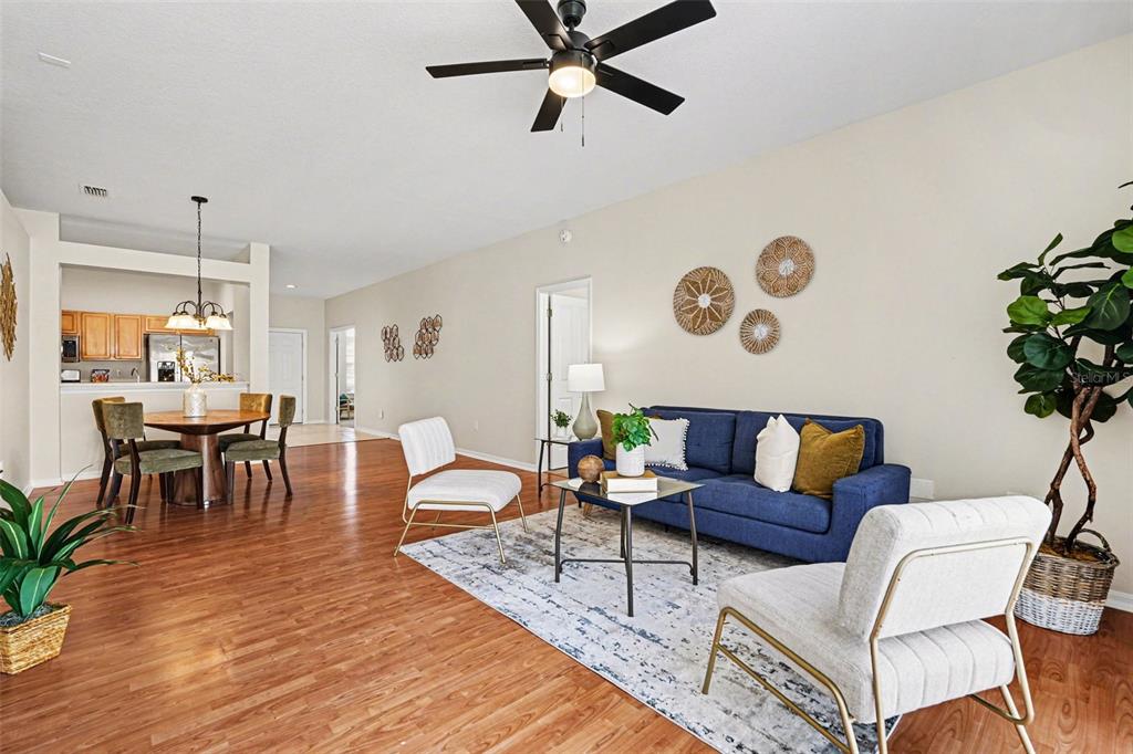 30631 Nickerson Loop Wesley Chapel, FL 33543 - Photo 10 of 33 a living room with furniture and wooden floor