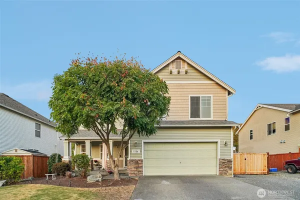 a front view of a house with garden