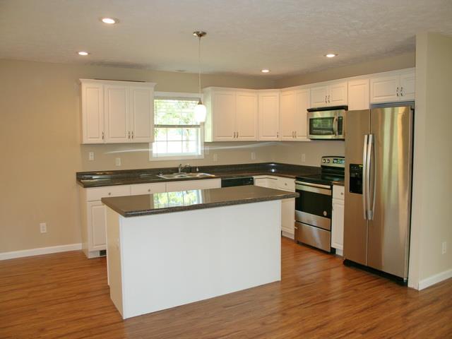 920 Double Bridge Road Lewisburg, TN 37091 - Photo 5 of 21 Shining white cabinets, black formica tops. Island has storage drawers.