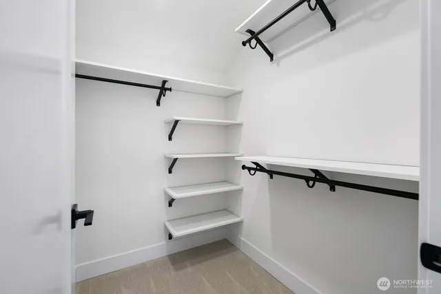 a view of room with racks on the wall