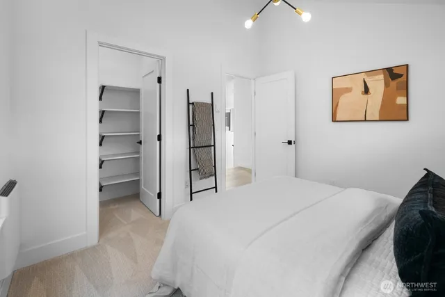 a bedroom with a bed and a cabinets