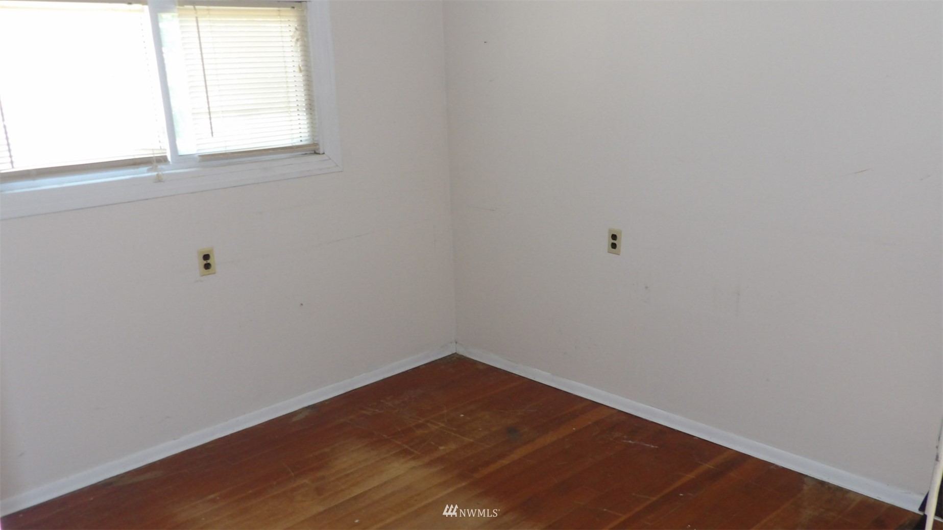 413 North Snyder Road Ritzville, WA 99169 - Photo 16 of 21 a view of a small space with wooden floor and a window