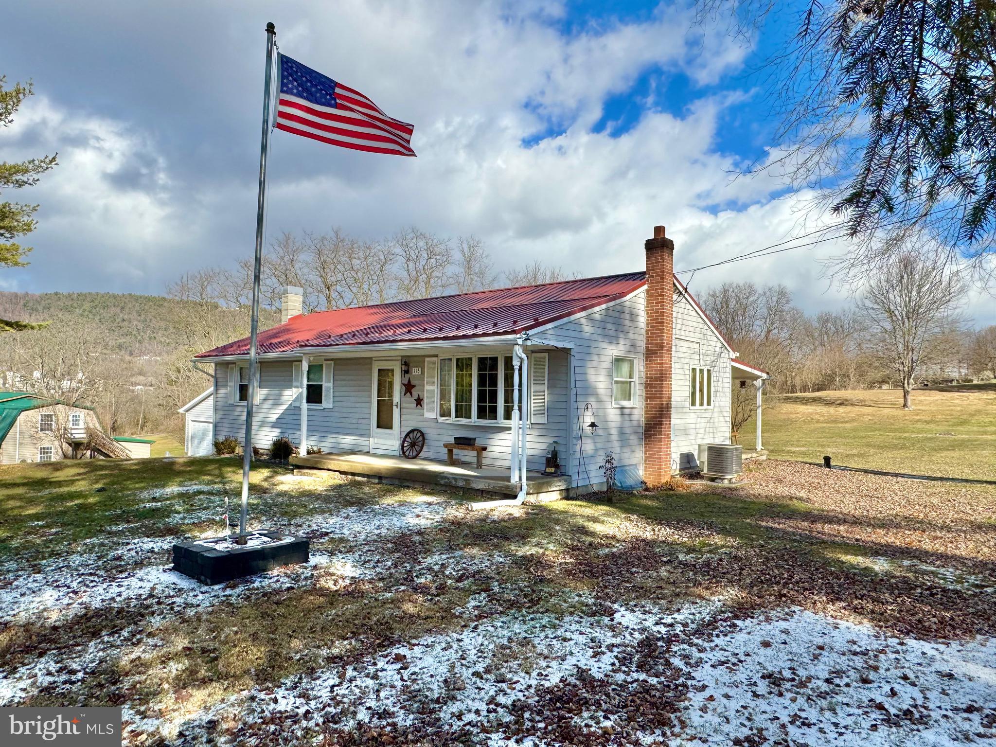 115 Upper Gyp Road Bellefonte, PA 16823 - Photo 19 of 27 a front view of a house with garden