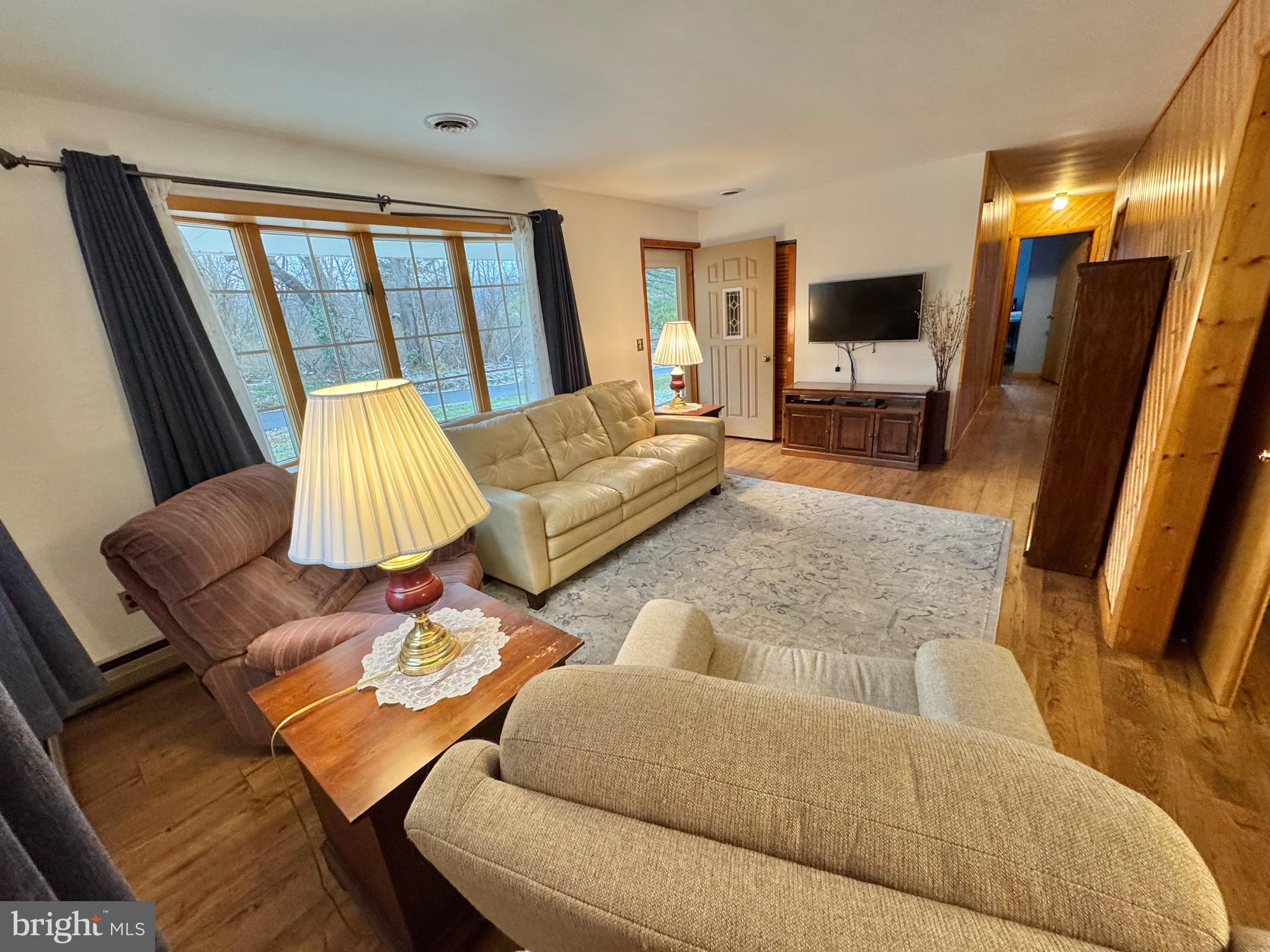 115 Upper Gyp Road Bellefonte, PA 16823 - Photo 4 of 27 a living room with furniture and a flat screen tv