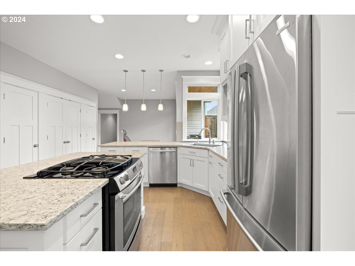 625 3rd Street Lake Oswego, OR 97034 - Photo 18 of 43 a kitchen with a sink stove and refrigerator