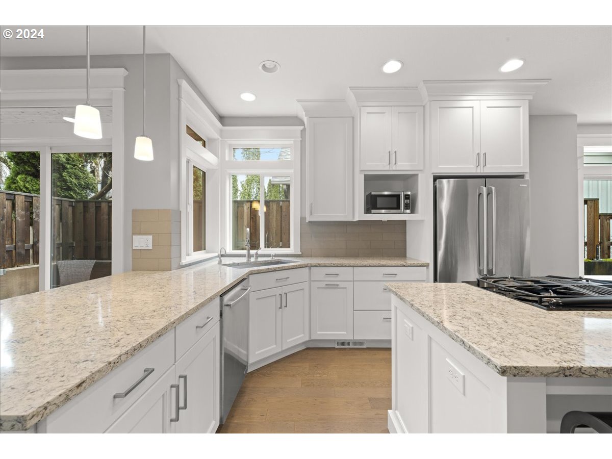 625 3rd Street Lake Oswego, OR 97034 - Photo 19 of 43 a kitchen with stainless steel appliances granite countertop a sink and a refrigerator