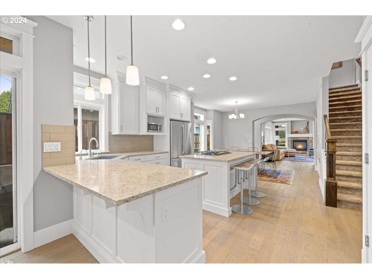 625 3rd Street Lake Oswego, OR 97034 - Photo 20 of 43 a kitchen with kitchen island a sink appliances and a counter top space