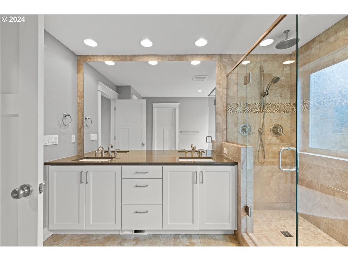625 3rd Street Lake Oswego, OR 97034 - Photo 28 of 43 a bathroom with a granite countertop sink a mirror and shower