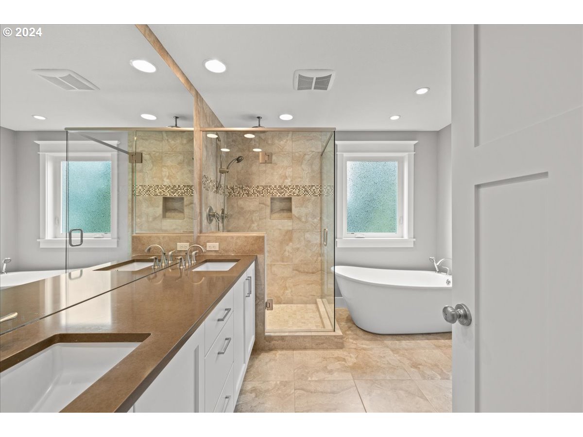 625 3rd Street Lake Oswego, OR 97034 - Photo 30 of 43 a bathroom with a granite countertop sink a toilet a bathtub and shower