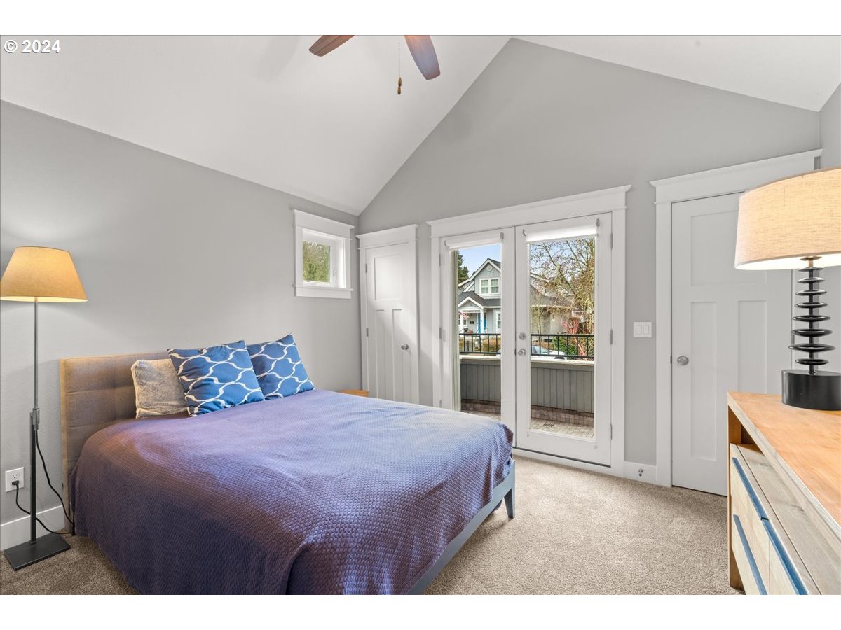 625 3rd Street Lake Oswego, OR 97034 - Photo 33 of 43 a bedroom with a large bed and a lamp