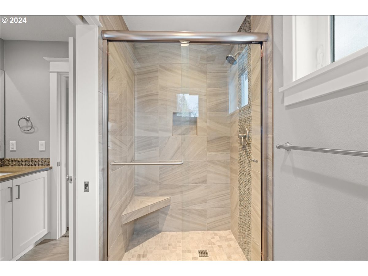 625 3rd Street Lake Oswego, OR 97034 - Photo 36 of 43 a bathroom with a granite countertop shower mirror and a sink
