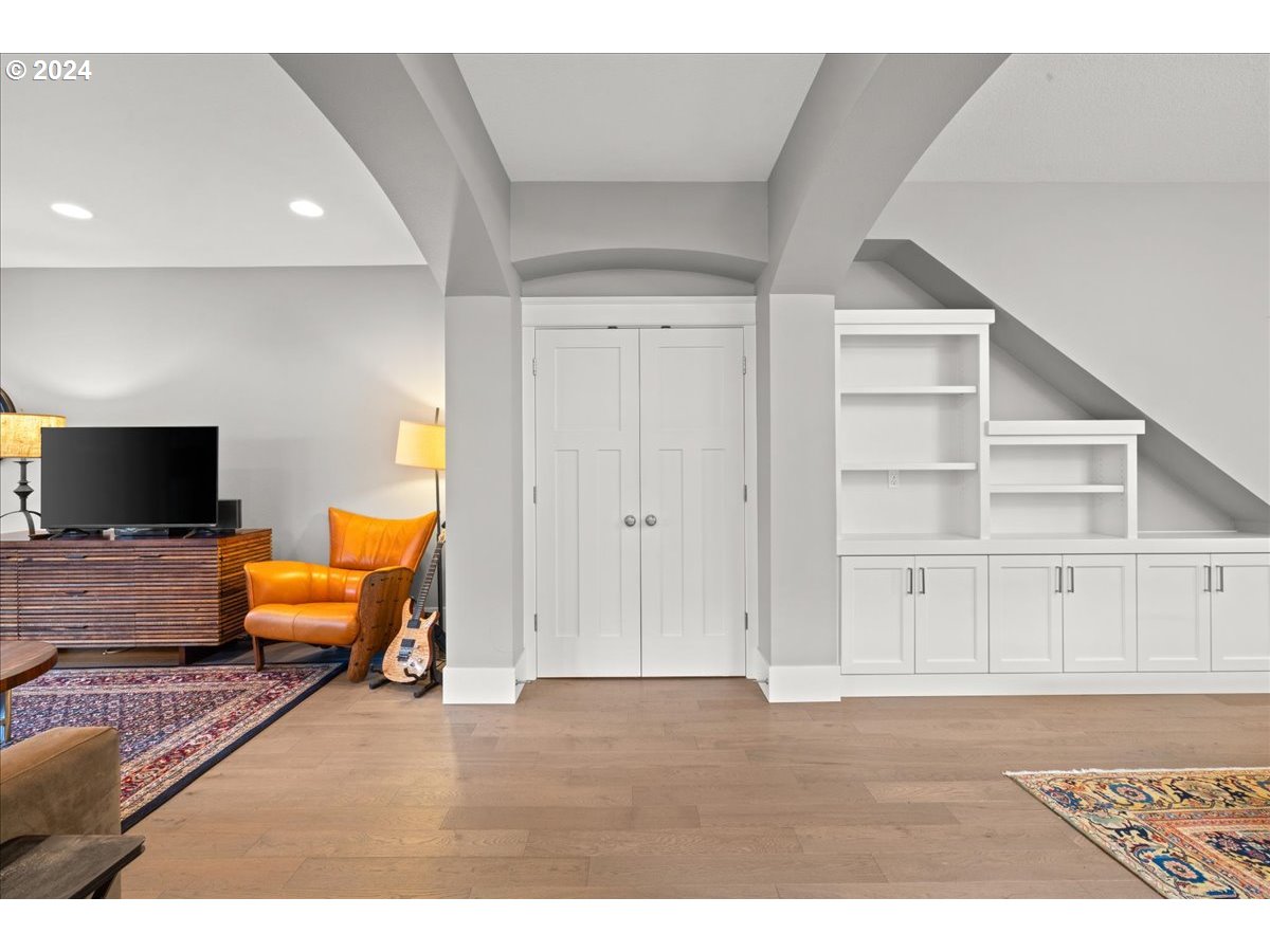 625 3rd Street Lake Oswego, OR 97034 - Photo 6 of 43 a living room with furniture wooden floor and a flat screen tv