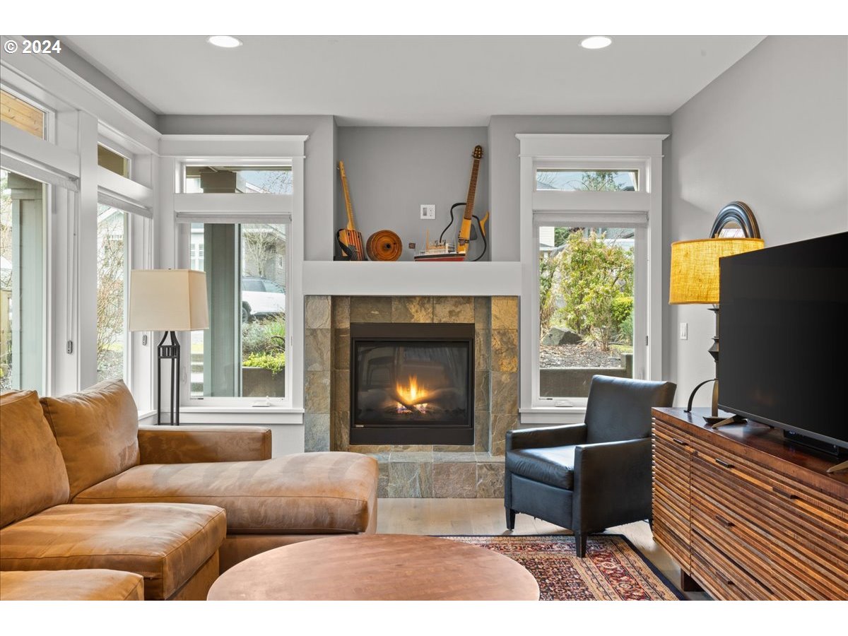 625 3rd Street Lake Oswego, OR 97034 - Photo 9 of 43 a living room with furniture and a fireplace