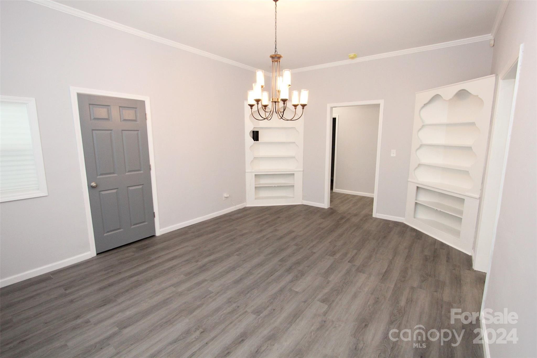 807 East Washington Street Rockingham, NC 28379 - Photo 20 of 42 a view of a livingroom with wooden floor and entryway
