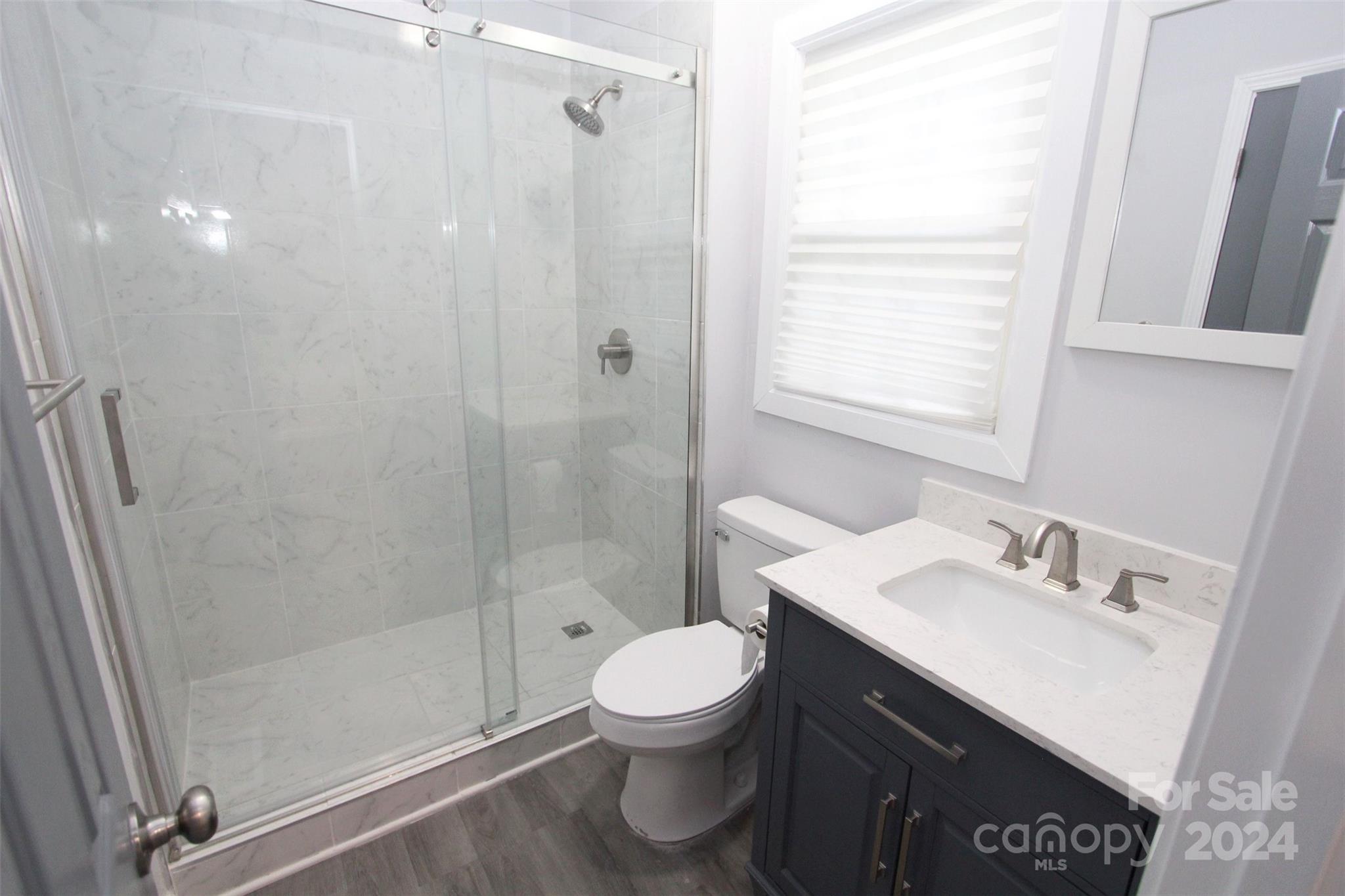 807 East Washington Street Rockingham, NC 28379 - Photo 32 of 42 a bathroom with a sink a toilet and shower
