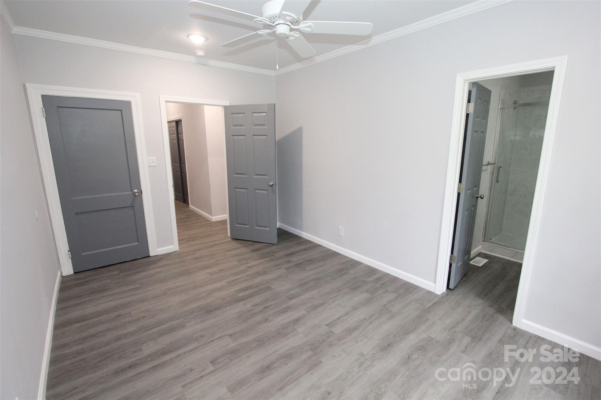 807 East Washington Street Rockingham, NC 28379 - Photo 34 of 42 an empty room with wooden floor and closet area