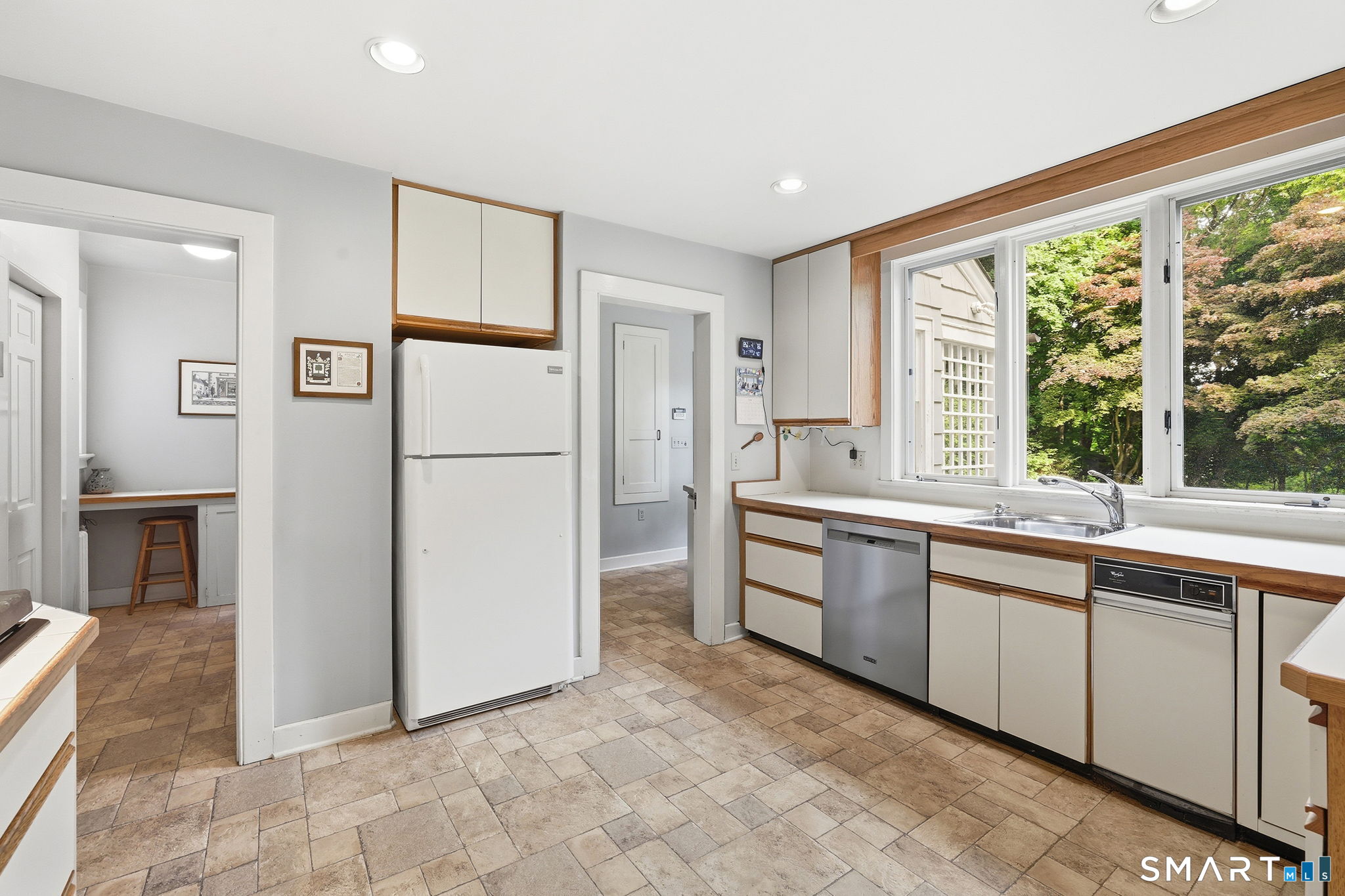 73 Inwood Road Fairfield, CT 06825 - Photo 25 of 40 The kitchen is sited nicely with great views of the back yard.