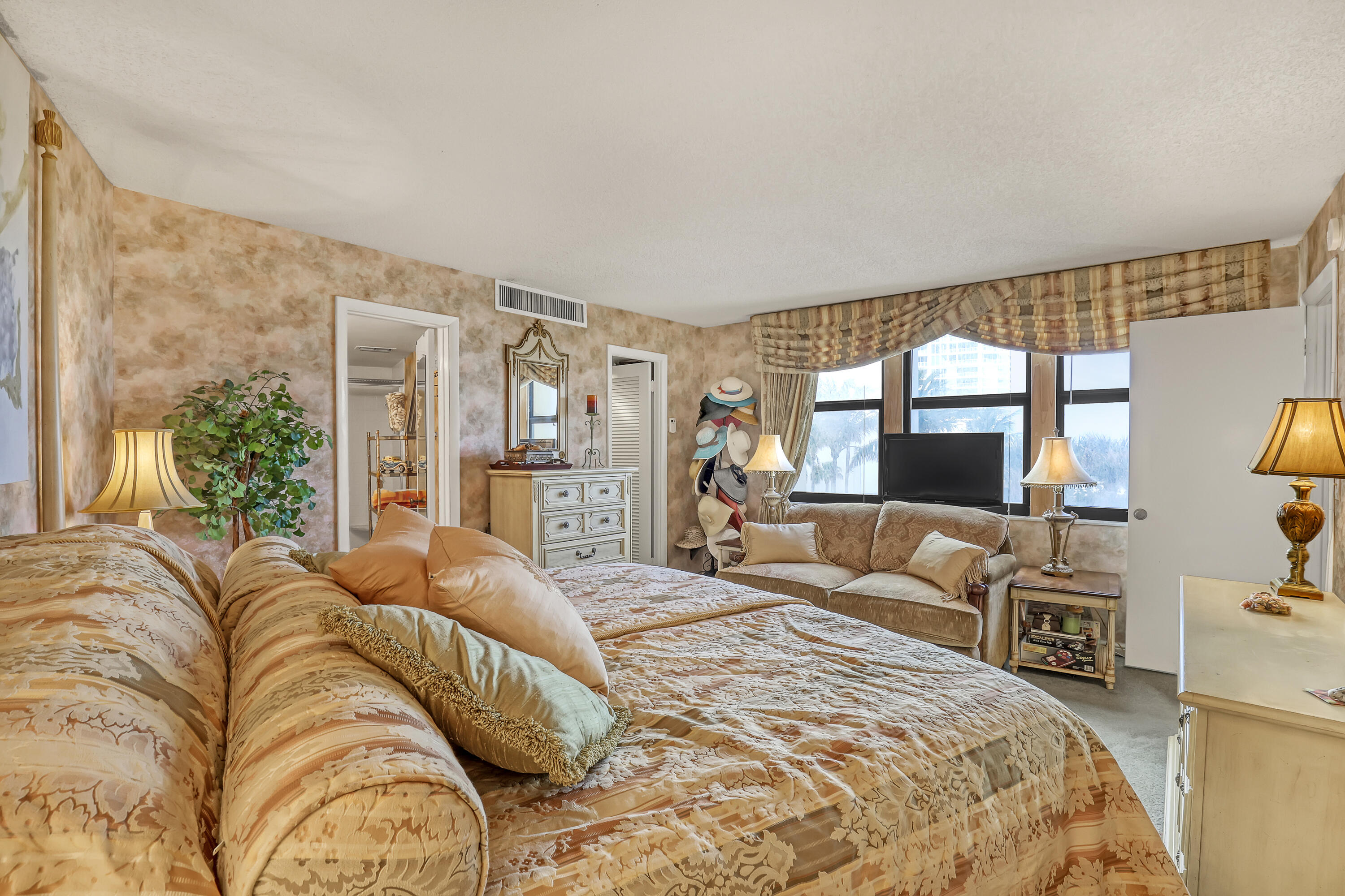 2800 North Ocean Drive, Unit A3C Singer Island, FL 33404 - Photo 12 of 28 a bedroom with a large bed and a large window