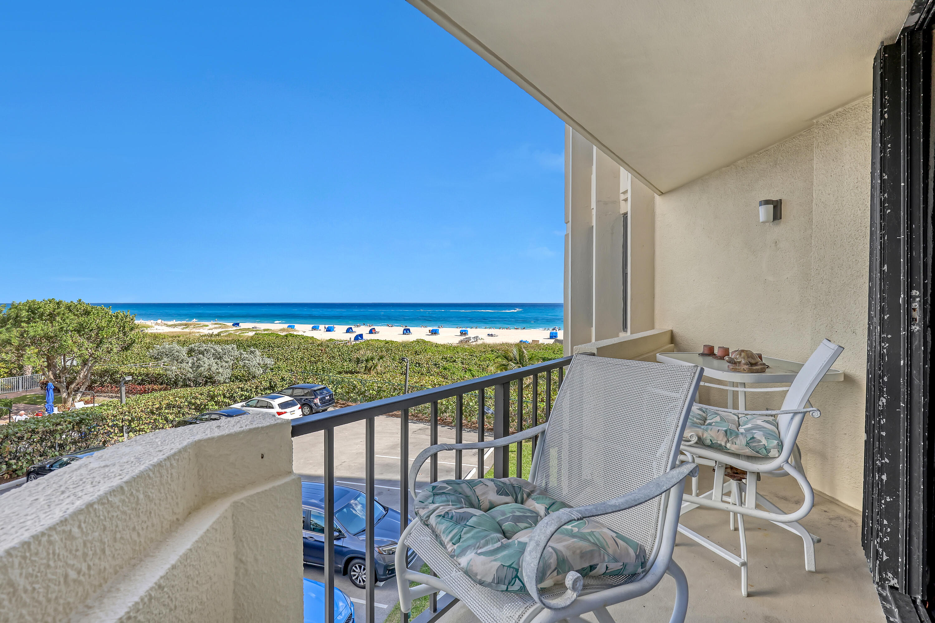 2800 North Ocean Drive, Unit A3C Singer Island, FL 33404 - Photo 2 of 28 a view of a balcony with chair and table