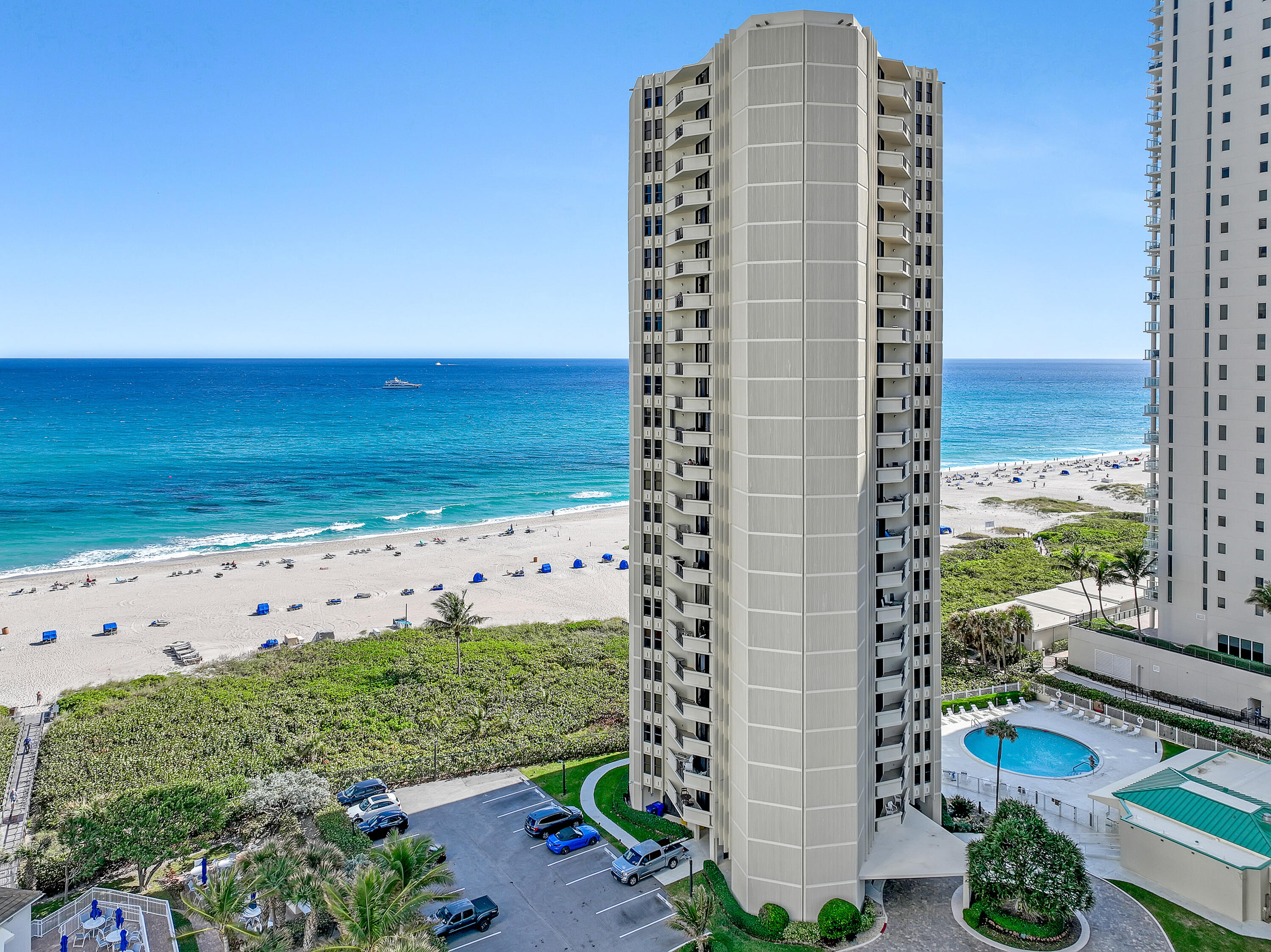 2800 North Ocean Drive, Unit A3C Singer Island, FL 33404 - Photo 24 of 28 a view of a large building with a yard