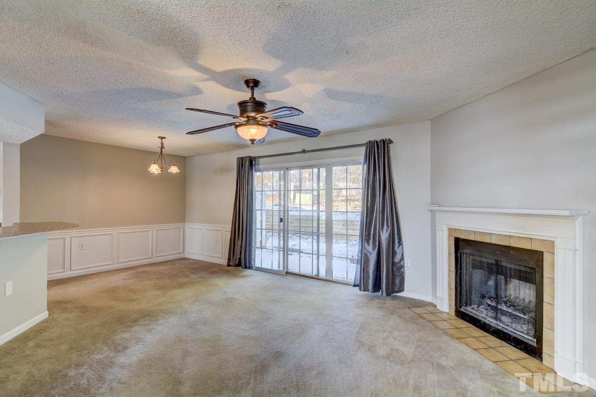 7607 Falcon Rest Circle, Unit 7607 Raleigh, NC 27615 - Photo 3 of 12 a view of an empty room with a fireplace