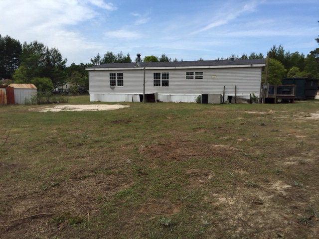 2355 Hortman Mill Road Roberta, GA 31078 - Photo 5 of 9 a view of a house with a yard