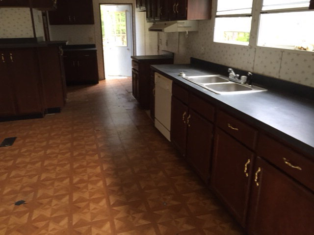 2355 Hortman Mill Road Roberta, GA 31078 - Photo 7 of 9 a kitchen with a sink stove and refrigerator