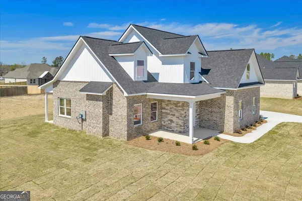 a front view of a house with a yard