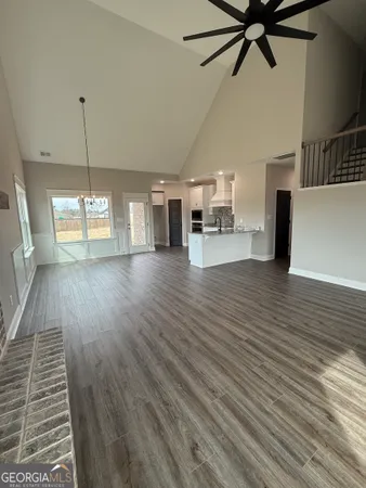 a view of a room with lots of wooden furniture