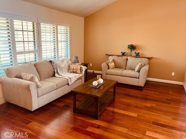1812 Fairview Drive Corona, CA 92878 - Photo 12 of 15 a living room with furniture and a wooden floor