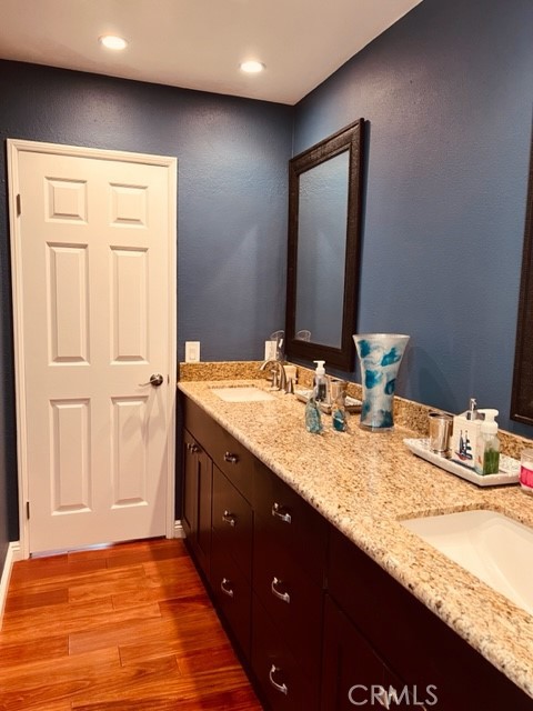 1812 Fairview Drive Corona, CA 92878 - Photo 8 of 15 a bathroom with a granite countertop sink and a mirror