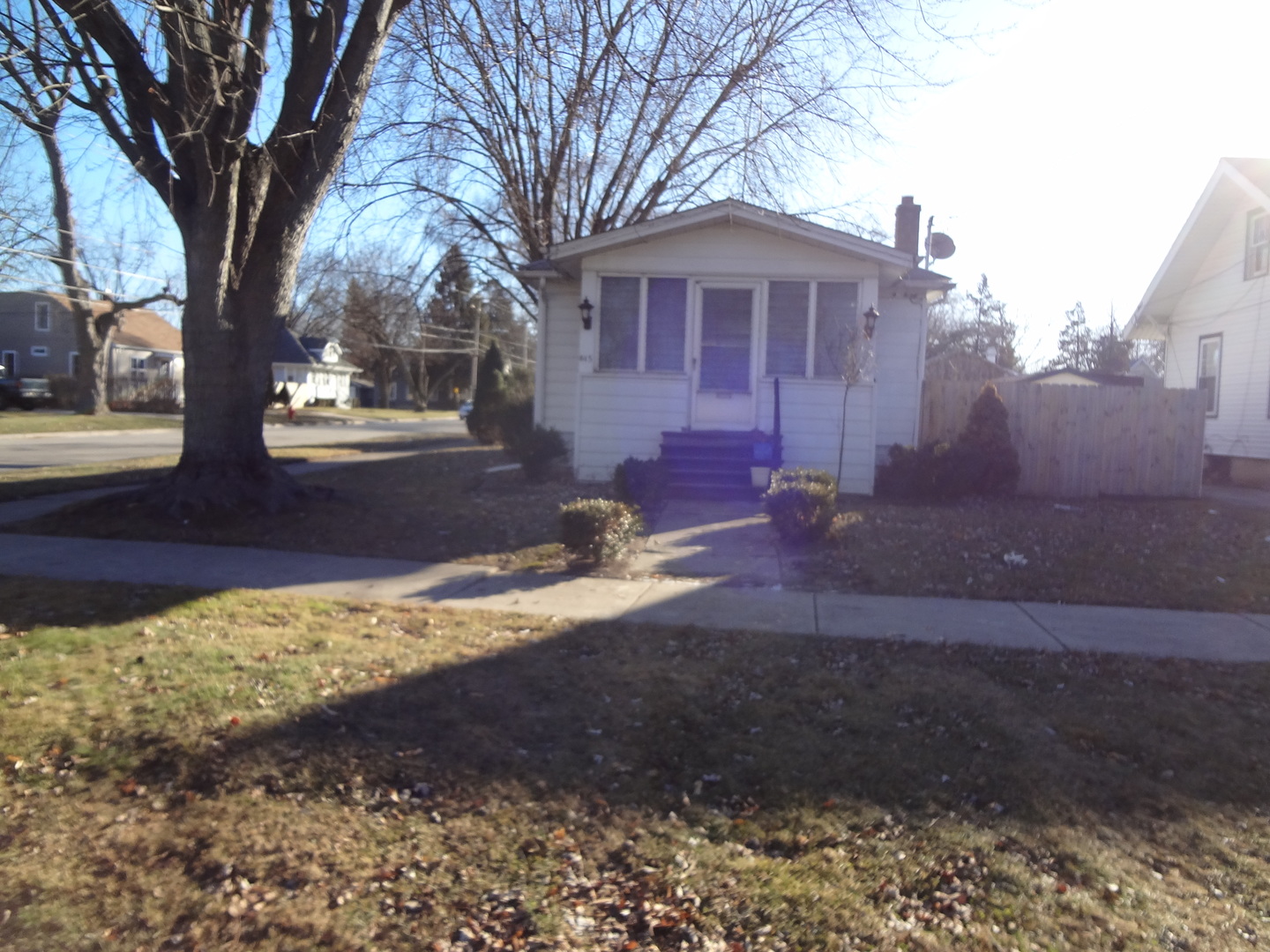 645 Slade Avenue Elgin, IL 60120 - Photo 1 of 7 a front view of a house with a yard covered with snow