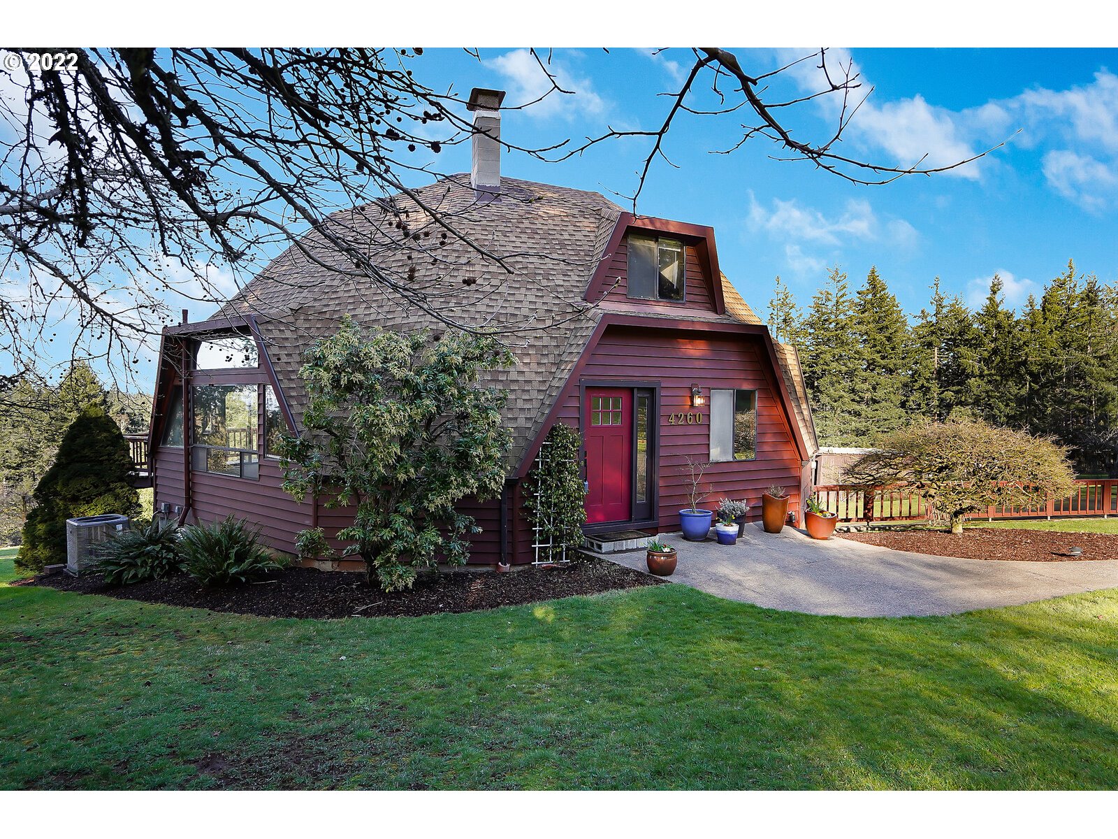 4260 Victor Point Road Northeast Silverton, OR 97381 - Photo 2 of 32 a view of a house with a big yard potted plants and large tree