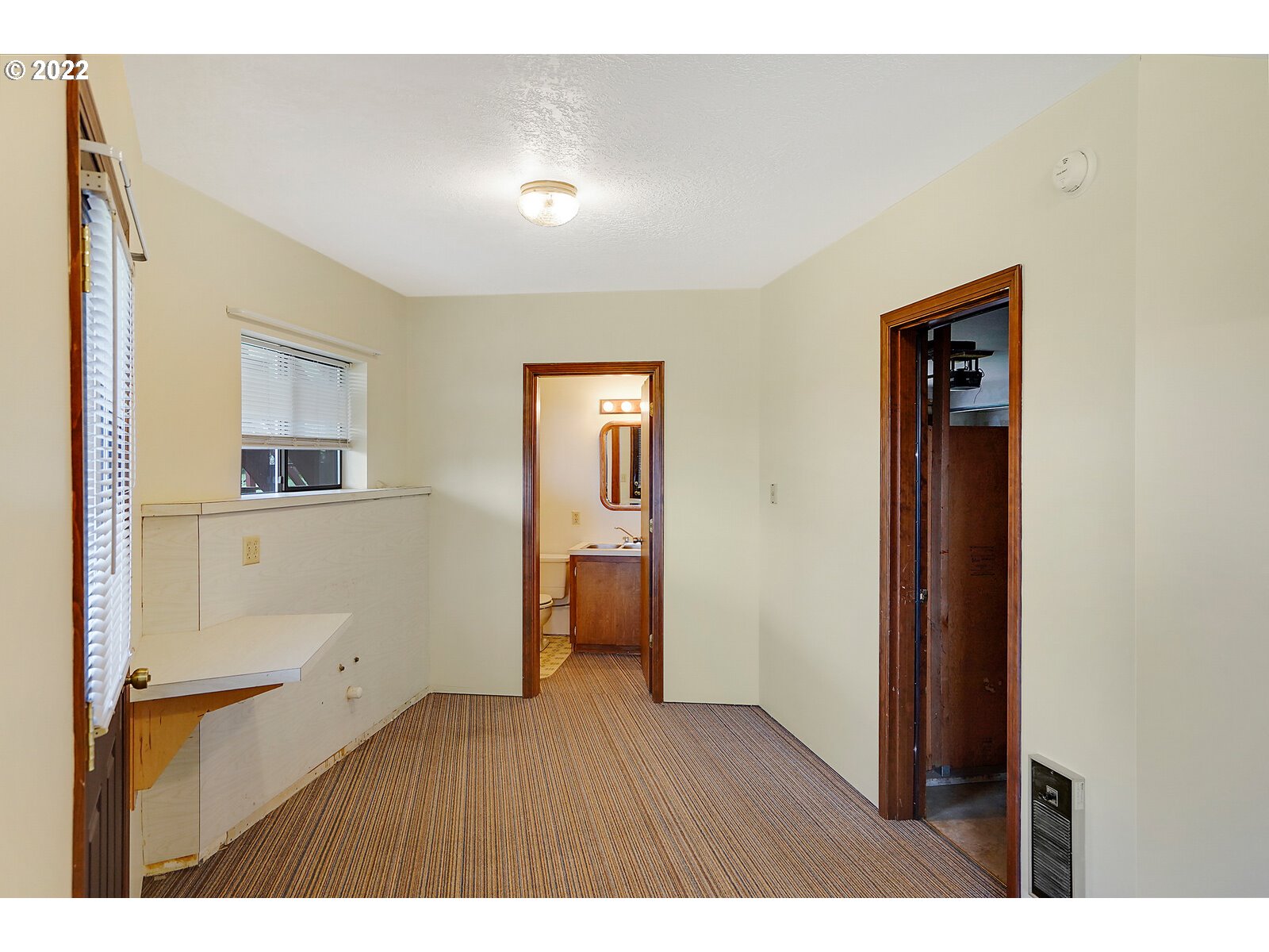 4260 Victor Point Road Northeast Silverton, OR 97381 - Photo 21 of 32 a room with a closet and wooden floor