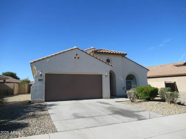 a front view of a house with a garage