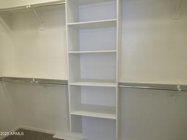 a view of an empty walk in closet