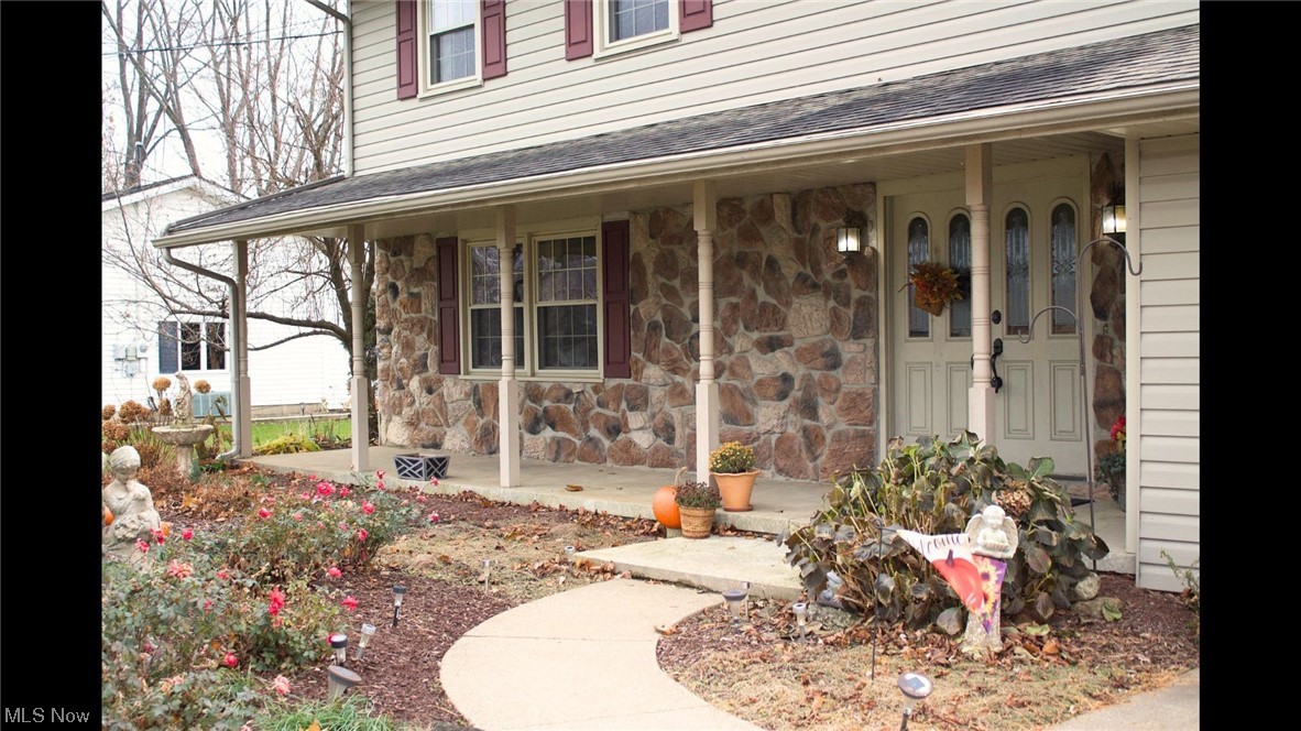 5406 McCartney Road Sandusky, OH 44870 - Photo 2 of 17 View of exterior entry featuring a porch