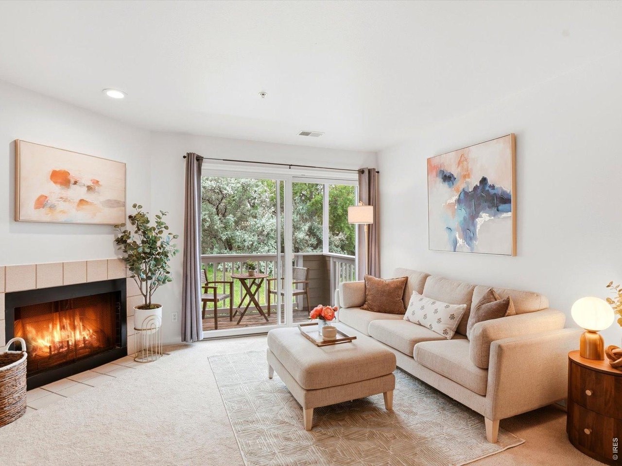 4945 Twin Lakes Road, Unit 46 Boulder, CO 80301 - Photo 9 of 42 The cozy gas fireplace and seamless indoor-outdoor flow make this space ideal year-round.
