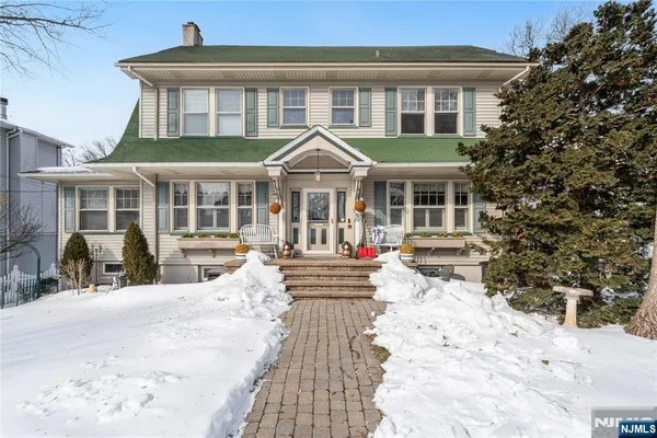 a front view of a house with a yard patio and fire pit