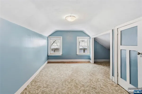 a bathroom with a sink mirror vanity and toilet